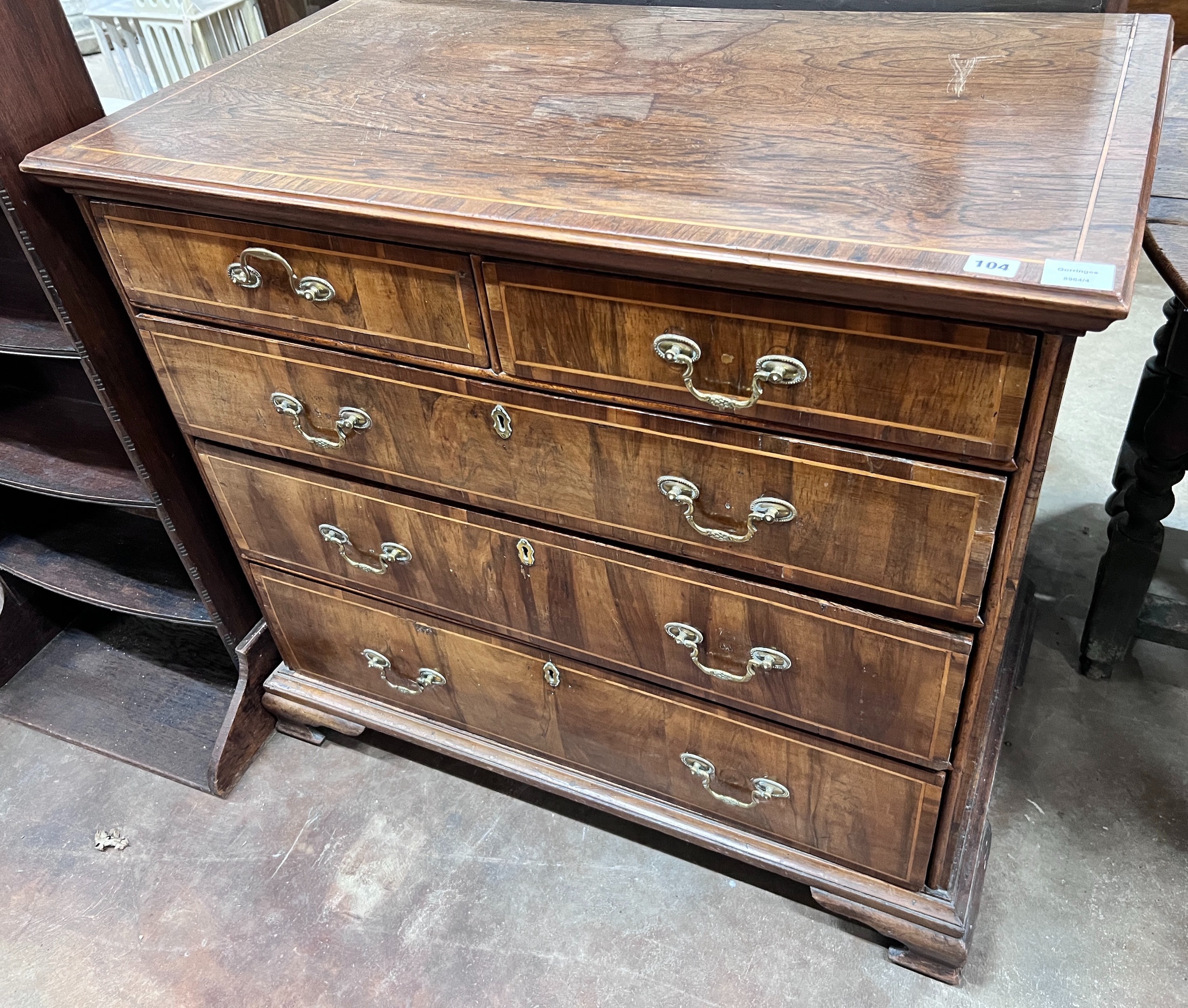 An 18th century later banded walnut chest, width 97cm, depth 56cm, height 88cm *Please note the sale commences at 9am.